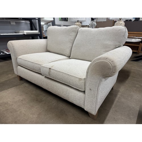 3360 - An oatmeal fabric two seater sofa