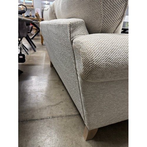 3360 - An oatmeal fabric two seater sofa
