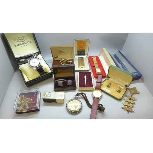A collection of assorted items including a Wingmaster wristwatch, a ...