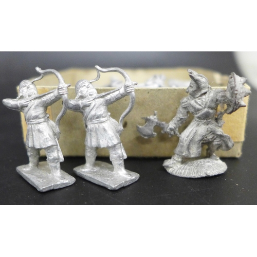 A collection of lead figures, some painted