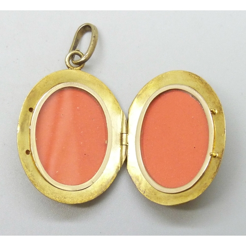 7002 - An early 20th Century yellow metal locket set with opals, emerald and small diamonds, 15.6g, 27mm wi... 