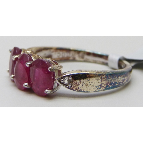 7023 - A silver gilt, ruby and white stone ring, S
