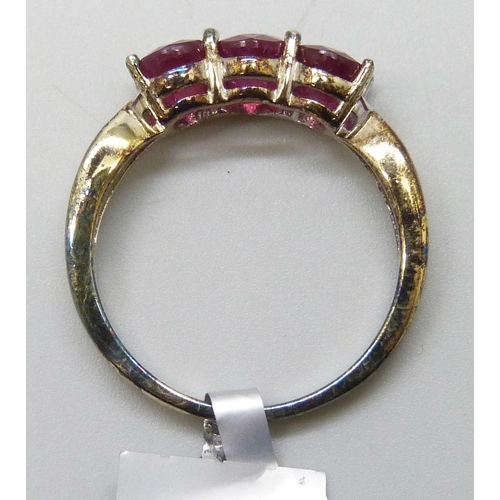 7023 - A silver gilt, ruby and white stone ring, S