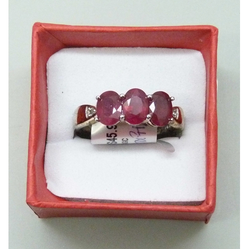 7023 - A silver gilt, ruby and white stone ring, S