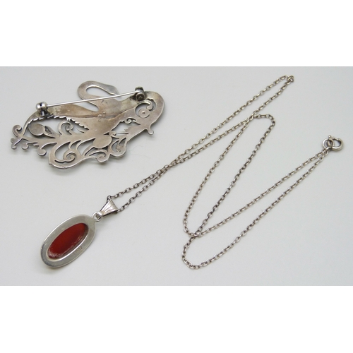 7028 - A silver and enamel bird brooch, Birmingham, 1916, a 925 silver stylised swan brooch, and a silver p... 