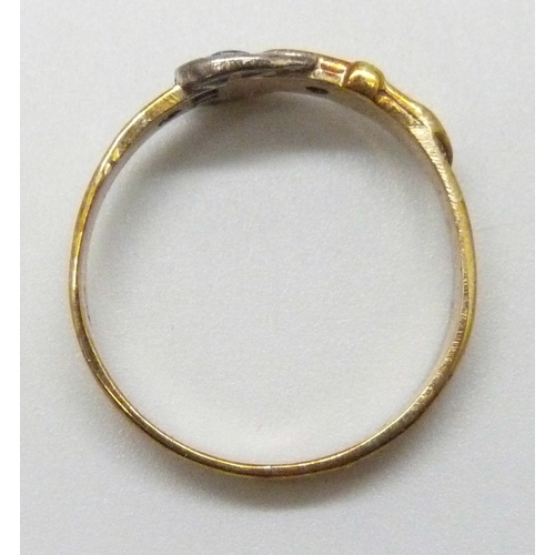 7030 - A 9ct gold buckle ring set with diamonds, 1.8g, M