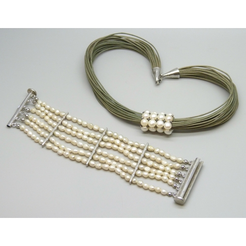 7034 - A freshwater pearl bracelet and a silver mounted necklace with pearl detail