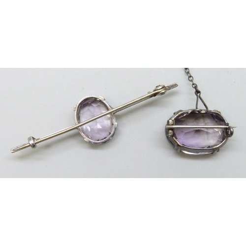 7048 - Two early 20th Century brooches - a silver brooch set with an amethyst, and a white metal bar brooch... 