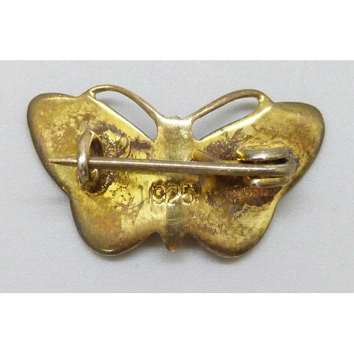 7055 - A silver gilt and enamel insect design brooch in the form of a butterfly, 2.3 cm, enamel in good con... 
