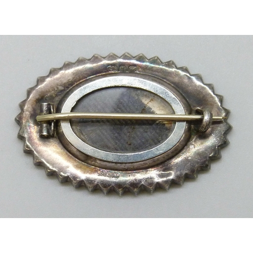 7057 - A Victorian silver mourning brooch, hallmarked Arthur Johnson Smith, Birmingham, 1883, 4cm