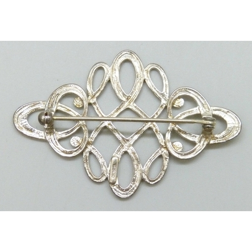 7061 - An Ola Gorie Scottish silver Celtic design brooch, 5.1cm