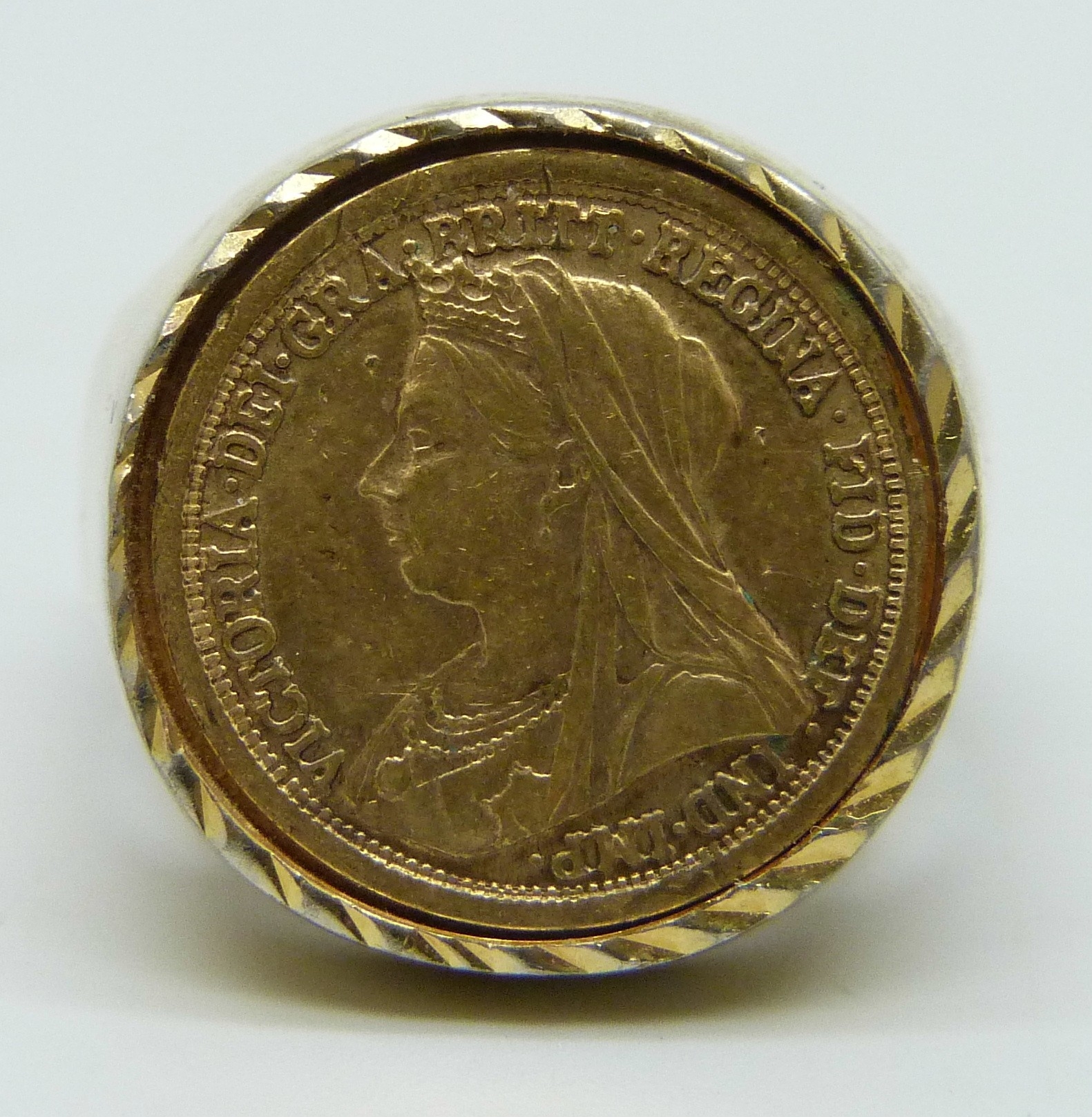 A large gilt coin ring, tests as silver, control marks to outer shank ...