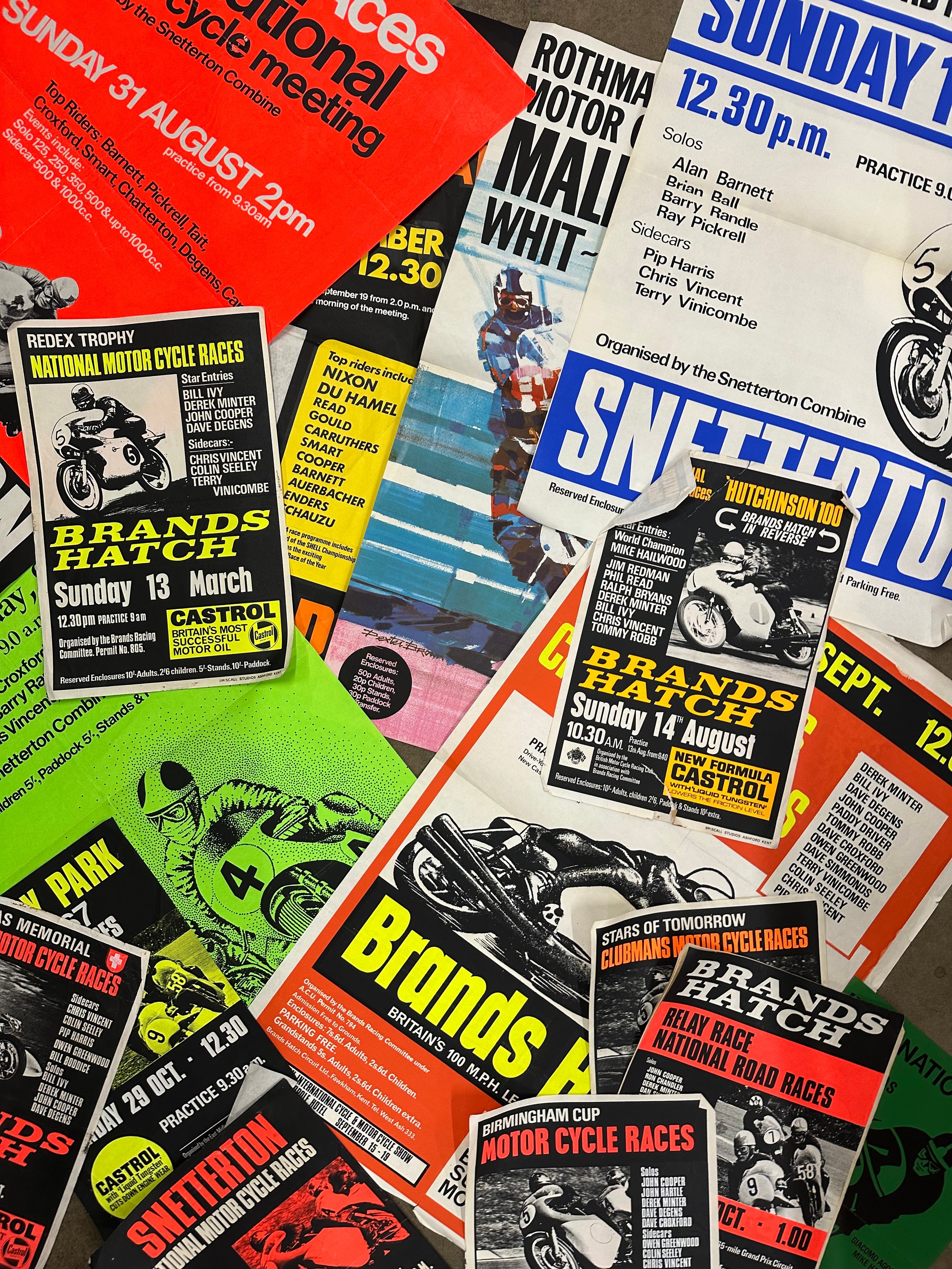 A collection of motorcycle race programmes and posters