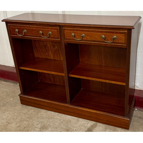 A Regency style inlaid mahogany two drawer bookcase