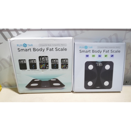 A box of miscellaneous items to include body fat scales, storage ...