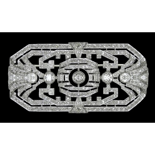 7116 - A large early 20th Century white metal and diamond set brooch, one stone missing, central stone appr...