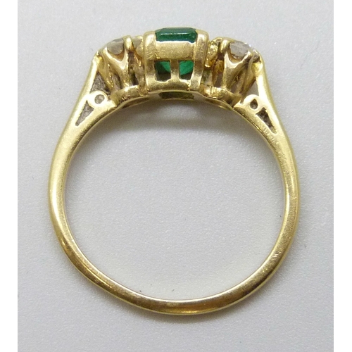 7131 - An 18ct yellow gold, emerald and diamond ring, 2.6g, I/J, band slightly misshapen
