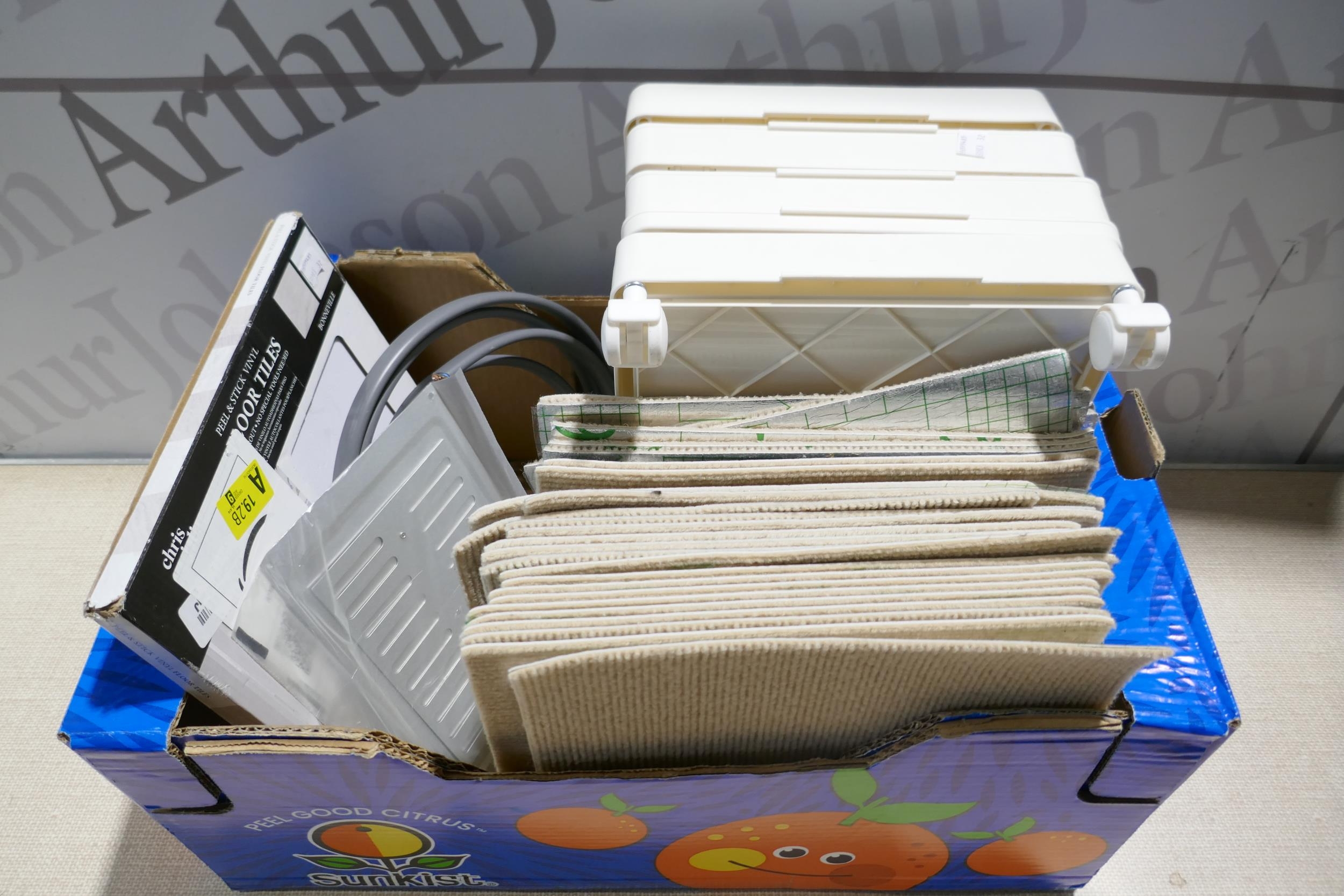 A box of miscellaneous items including sound reducing tiles, floor ...