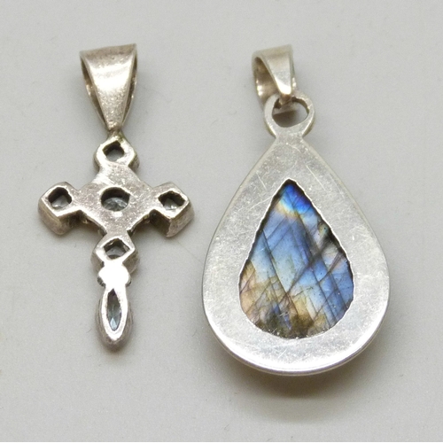 7064 - Two silver and gemstone necklace pendants including a topaz set cross, and a labradorite example, 3.... 