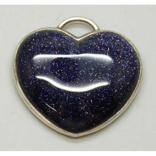 7065 - Whitney Kelly, a silver and purple goldstone heart pendant, 3.5cm x 3.6cm, 18g