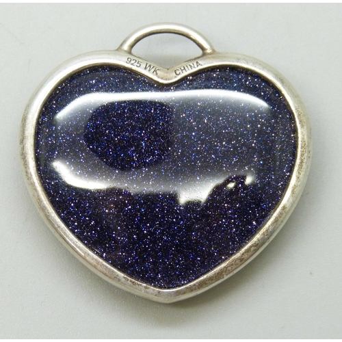 7065 - Whitney Kelly, a silver and purple goldstone heart pendant, 3.5cm x 3.6cm, 18g