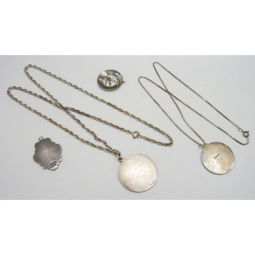 7079 - A collection of silver jewellery - two St Christopher pendants and chains, a silver fob, and a silve... 