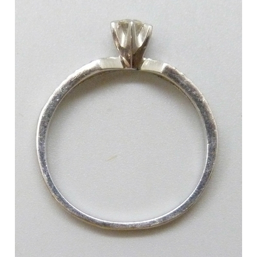 7083 - An 18ct white gold diamond solitaire ring, 3.1g, O