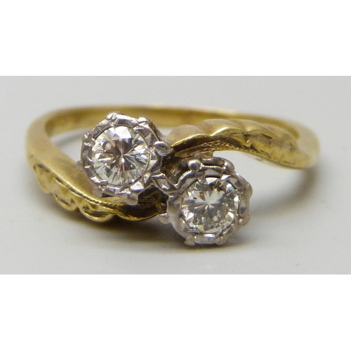7084 - An 18ct gold and and platinum two stone diamond crossover ring, 4.2g, O