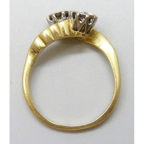 7084 - An 18ct gold and and platinum two stone diamond crossover ring, 4.2g, O