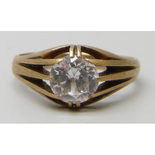 7085 - A 9ct gold white stone solitaire ring, testing as possibly sapphire, 2.8g, P