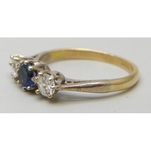 7086 - An 18ct gold and platinum blue stone (possibly topaz) and diamond ring, 2.3g, J