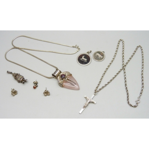 7088 - A silver rope chain necklace with a white metal cross pendant, and other silver and white metal jewe... 