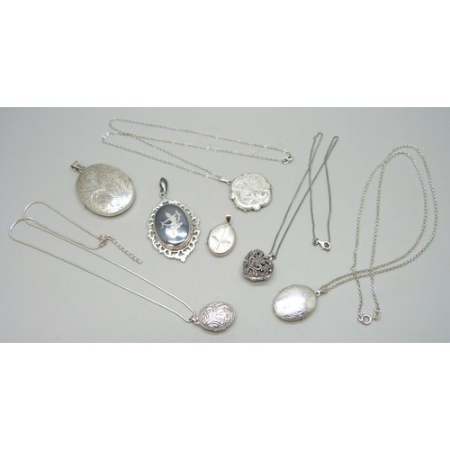 7093 - A collection of seven silver lockets, some with silver chains, 58g total