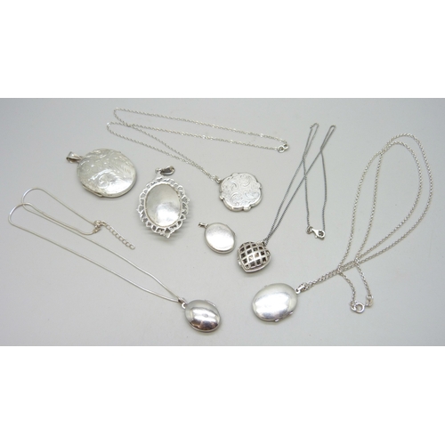 7093 - A collection of seven silver lockets, some with silver chains, 58g total