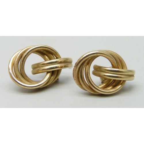 7101 - A pair of yellow metal knot earrings, the butterflies marked, 1.2g, 1.5cm