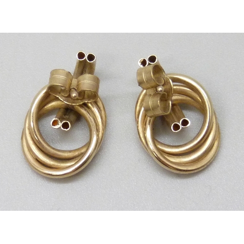 7101 - A pair of yellow metal knot earrings, the butterflies marked, 1.2g, 1.5cm