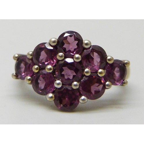 7102 - A TGGC silver gilt purple stone ring, J/K