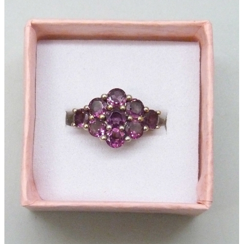 7102 - A TGGC silver gilt purple stone ring, J/K