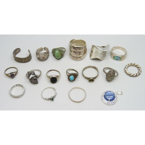 7104 - A collection of silver and white metal rings, 37g marked silver inclusing .835, 32g unmarked, and a ... 