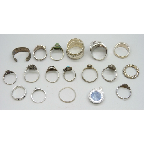 7104 - A collection of silver and white metal rings, 37g marked silver inclusing .835, 32g unmarked, and a ... 