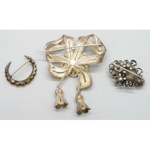 7107 - An Austro-Hungarian white metal pearl and garnet brooch, 2.7cm, a Victorian paste set crescent brooc... 