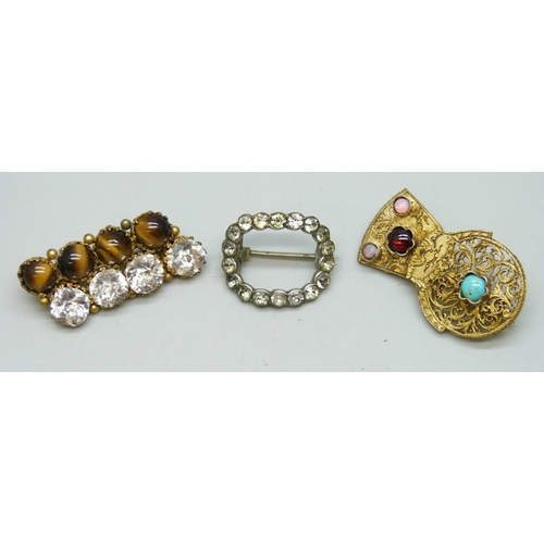 7110 - Three early 20th century brooches including a white metal buckle style brooch, and a brooch crafted ... 