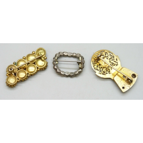 7110 - Three early 20th century brooches including a white metal buckle style brooch, and a brooch crafted ... 