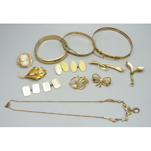 7111 - Three rolled gold bangles, a rolled gold cameo brooch, a rolled gold lead brooch, a pair of rolled g... 