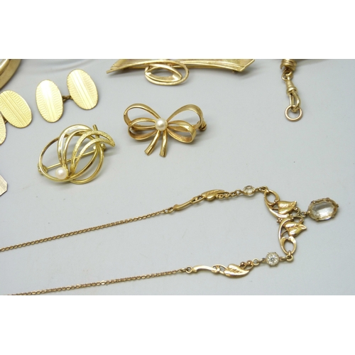 7111 - Three rolled gold bangles, a rolled gold cameo brooch, a rolled gold lead brooch, a pair of rolled g... 