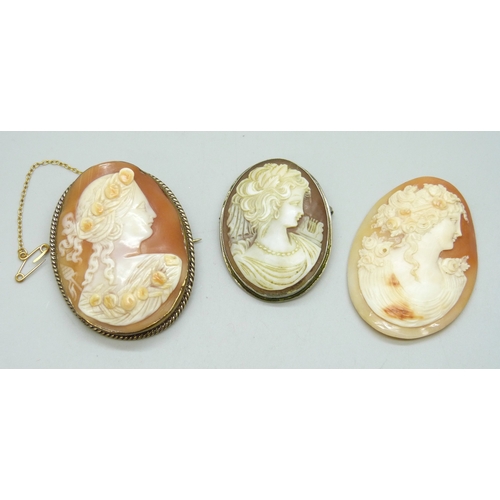 7114 - Two cameo brooches including a .800 silver example, and an unmounted cameo, largest 5.1cm