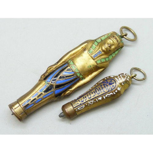 7118 - Two Egyptian sarcophagus pendant propelling pencils, largest 6.4cm