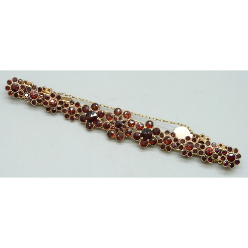 7119 - A Bohemian garnet set gilt metal floral cluster bracelet, 19g, 1.5cm largest cluster