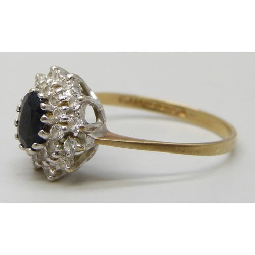 7127 - A 9ct gold, sapphire and white stone cluster ring, 2g, R