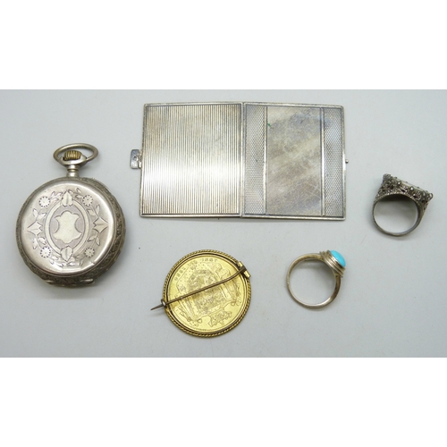 7154 - A pocket watch, a .935 silver miniature photograph frame, 33g, two silver rings, and a gilt coin bro... 